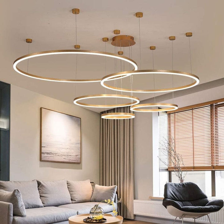 Vivid 5-ring circular chandelier light installed in a modern living room, providing elegant ambient lighting and a striking focal point