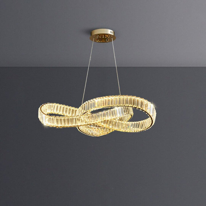 Vivid twisted crystal chandelier light illuminating luxury room, adding dynamic sparkle and elegant ambiance