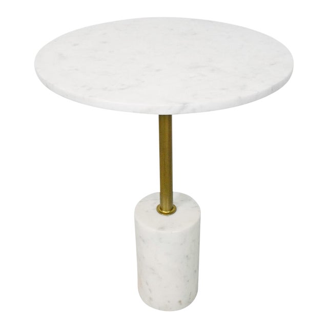 White marble side table with elegant brass legs, combining luxurious materials for a modern and sophisticated look
