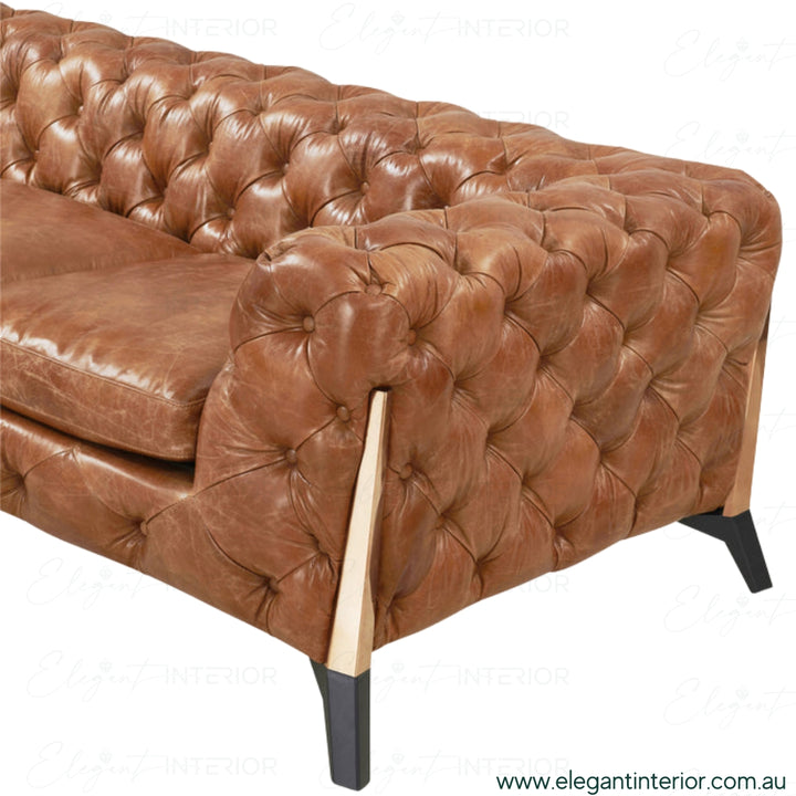 Close side view of American leather sofa in elegant Australian interior – detailed stitching and smooth leather texture