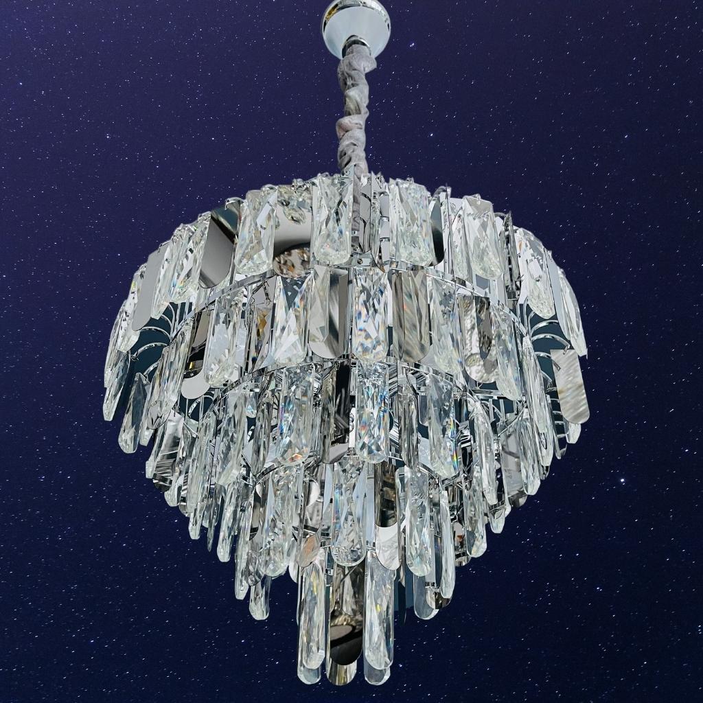 Detail view of Anita clear crystal chandelier with coffin drops, 6 bulbs over dining table