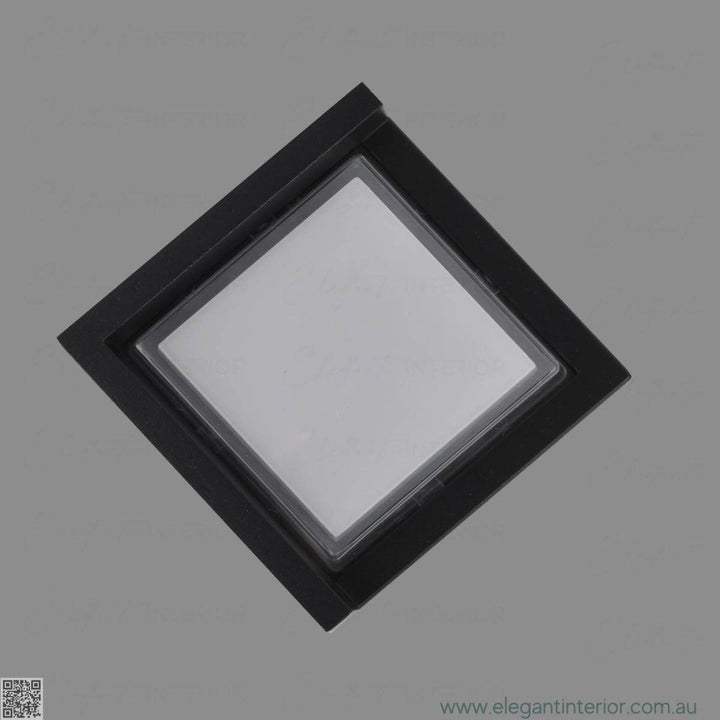 Detail view of Avon 1212 wall light lamp on, showcasing elegant design and warm illumination