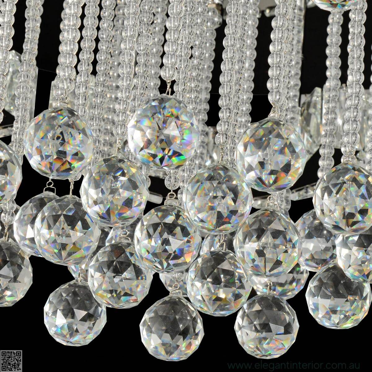 Close-up of elegant interior with crystal flush mount light and cloud-like design details