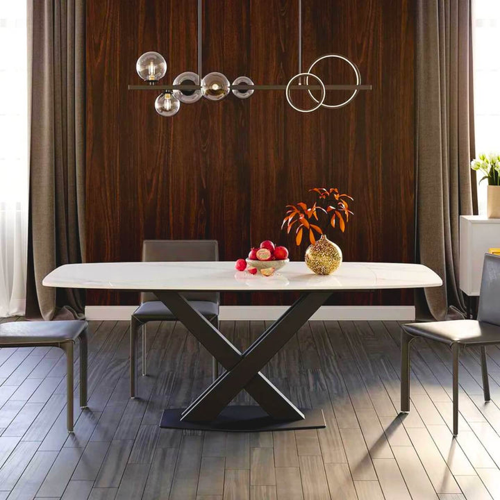 Front view of modern extendable marble dining table with X-base in a stylish contemporary setting