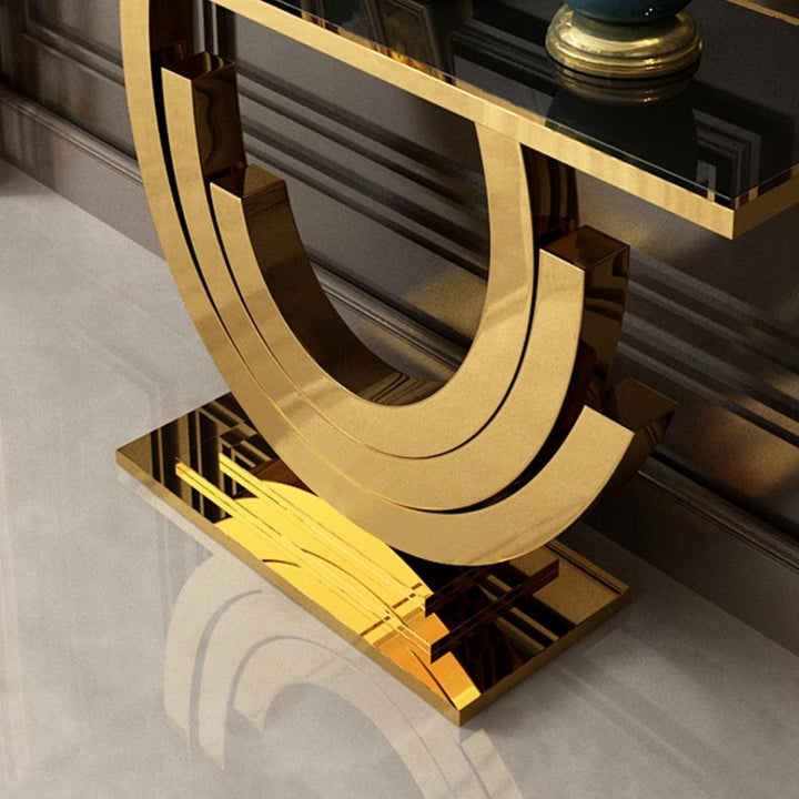 Top view of Lidia console table featuring black glass surface and gold frame in an elegant interior setting