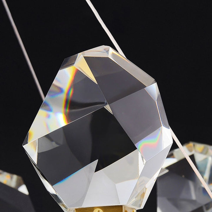 Detail view of Emerald Light LED gold chandelier in elegant Australian interior – close-up of sparkling diamond accents and warm LED glow