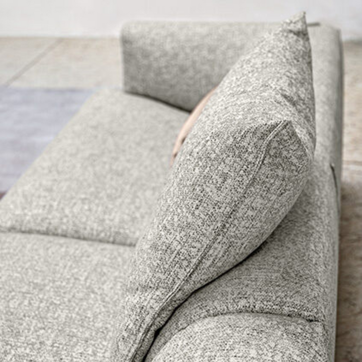 Side detail view of fabric textured sofa in Australia, highlighting premium material finish