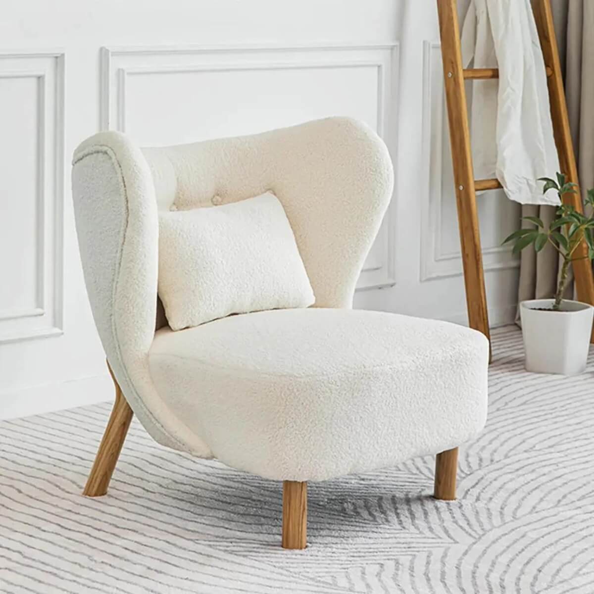 Side view of white lamb wool accent armchair in Australia showcasing cozy texture and design
