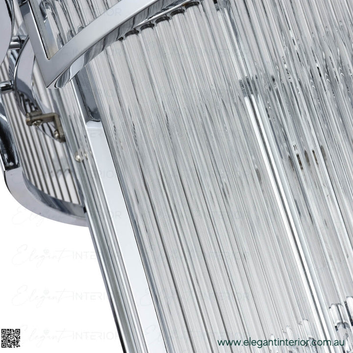 Detail view of Maddox chandelier light – close-up of chrome finish with glowing elegant illumination