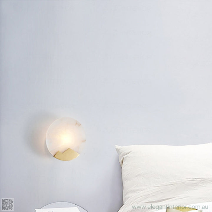 Marmar marble wall light beside bed, elegant bedside lighting with copper and alabaster.