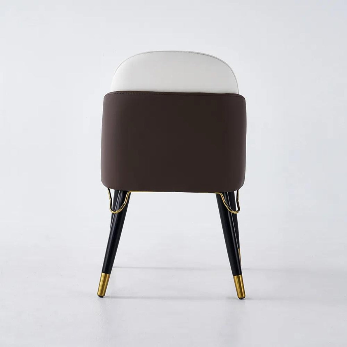 Back view of modern beige and black dining room chairs showcasing elegant design details