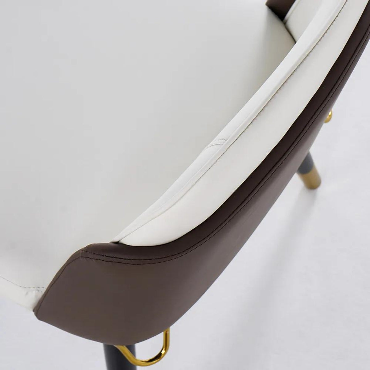 Top view of modern beige and black dining room chairs showcasing sleek design and colors