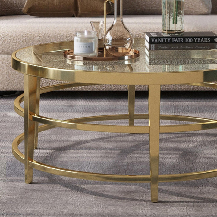 Detail view of Rose luxury coffee table – close-up of glass surface and polished gold base showcasing elegant craftsmanship