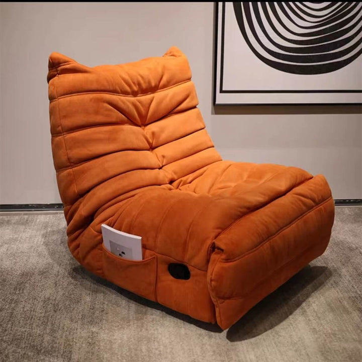 Side view of orange rotational recliner armchair showcasing vibrant color and ergonomic design