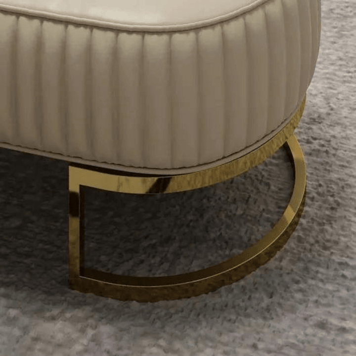 Side stand view of Shell leather oval bench with golden half-moon base, showcasing elegant support