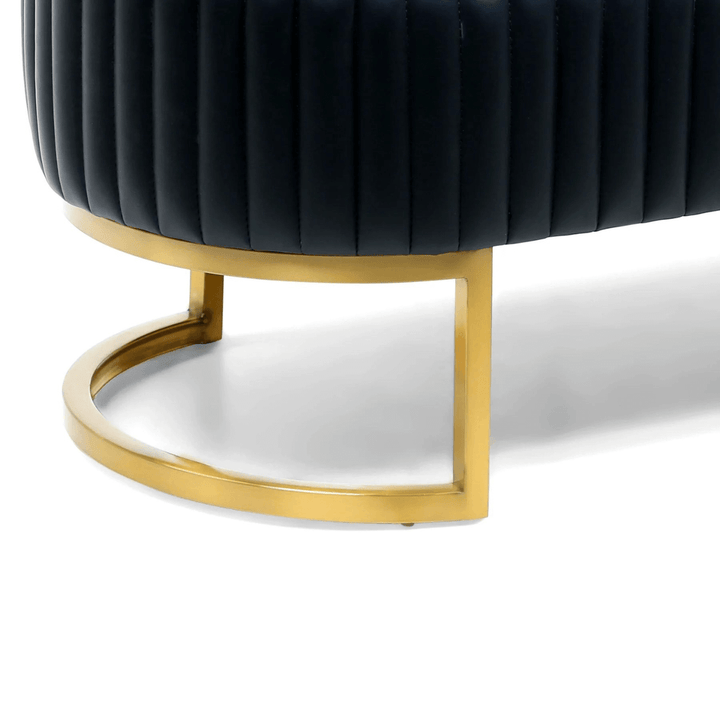 Stand detail of Shell leather oval bench with golden half-moon base, sleek sturdy support