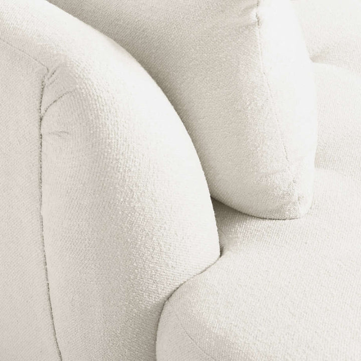 Side detail view of sinuous curved sofa in Australia – close-up of smooth contours and upholstery craftsmanship