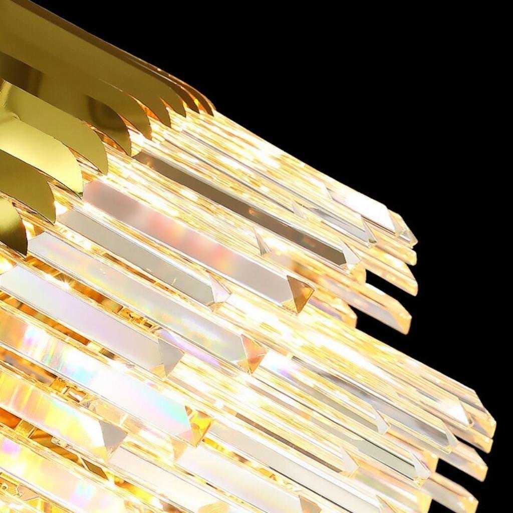 Detail view of Tara chandelier in elegant Australian interior with lights on – showcasing radiant crystals and warm illumination