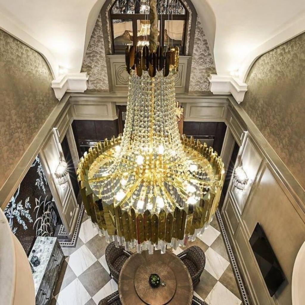 Top view of Tara chandelier in elegant Australian interior – showcasing intricate crystal design and polished metal finish