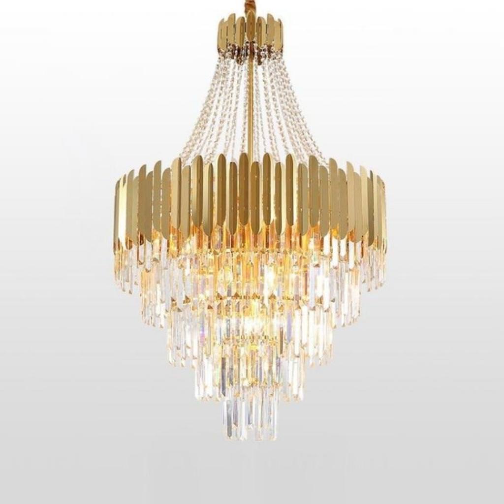 Angle view of Tara chandelier in elegant Australian interior with lights on – showcasing warm illumination and intricate design