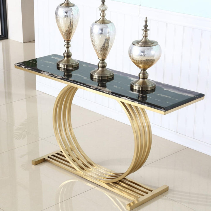 Side view of Trent console table featuring black marble top in an elegant interior setting