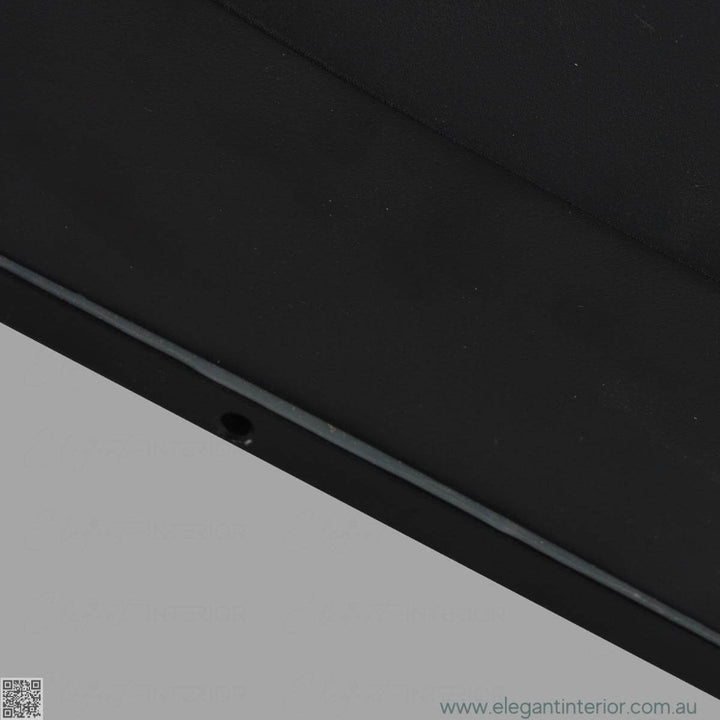 Detail view of Avon 1210 wall light lamp, showcasing sleek design and warm ambient lighting