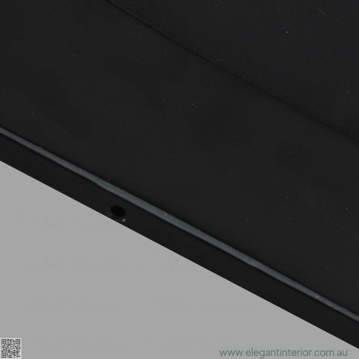 Detail view of Avon 1210 wall light lamp, showcasing sleek design and warm ambient lighting