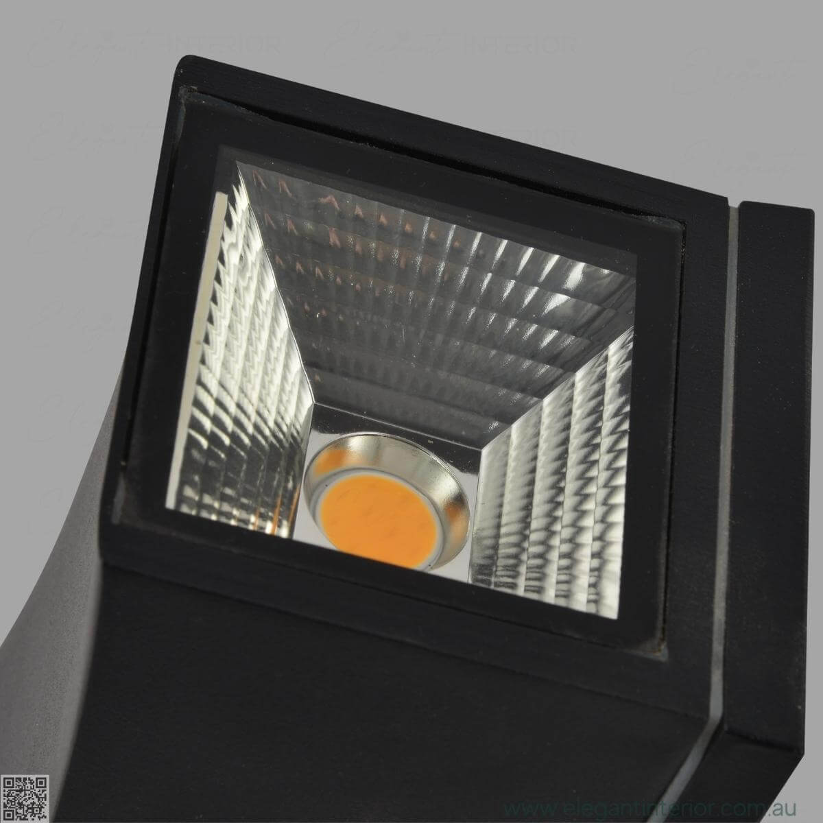 Light detail view of Avon 1211 wall light lamp, showcasing warm glow and elegant design