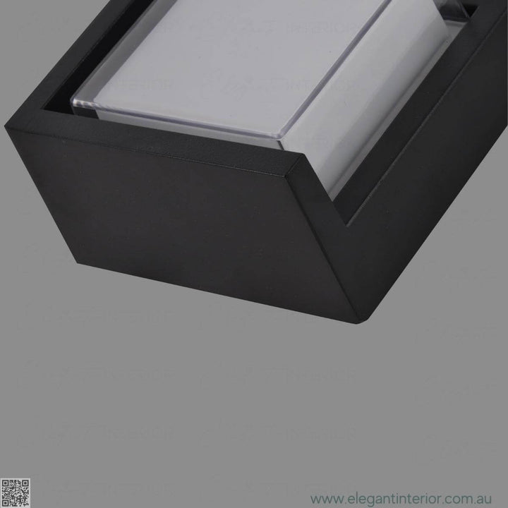 Head side detail view of Avon 1212 wall light lamp on, highlighting elegant design and glow