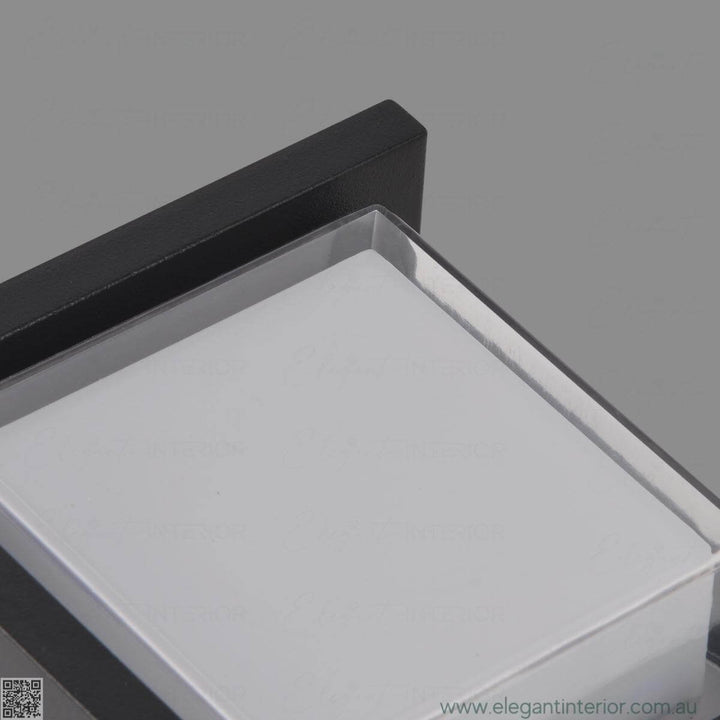 Detail view of Avon 1212 wall light lamp on, showcasing elegant design and warm illumination