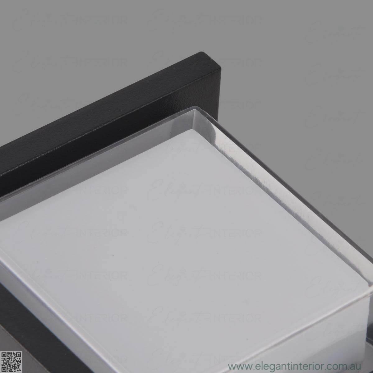 Detail view of Avon 1212 wall light lamp on, showcasing elegant design and warm illumination