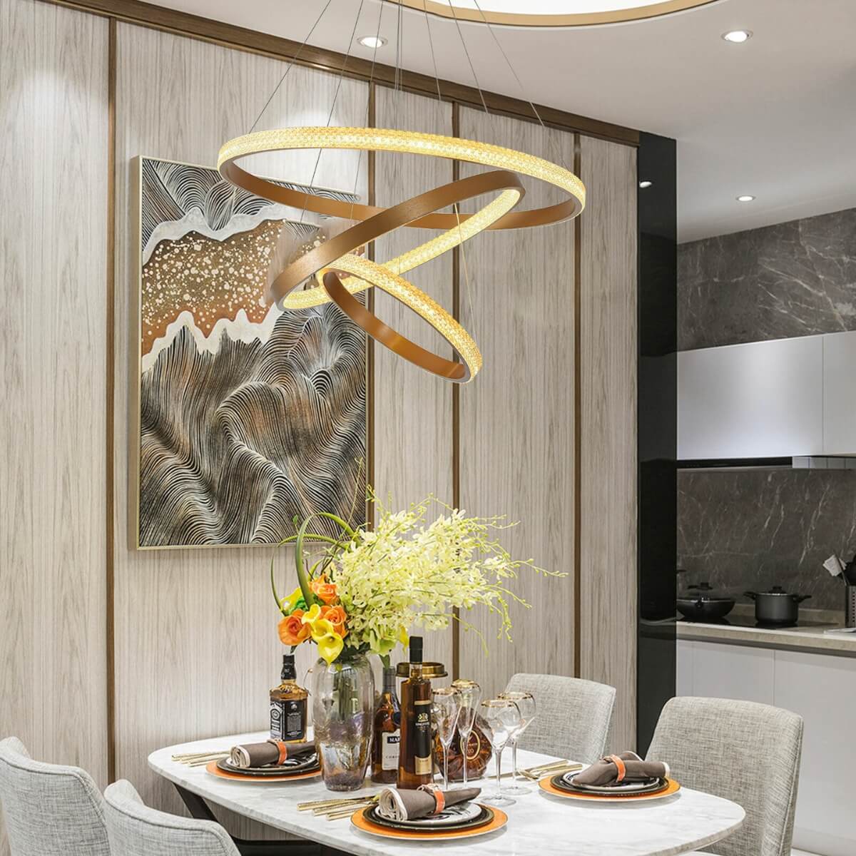 Claudia LED crystal pendant ceiling light illuminating elegant dining room setting