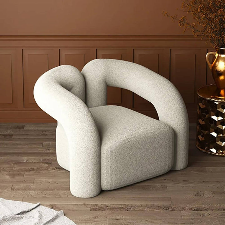 Side view of Asher designer armchair showcasing elegant lines and modern comfortable design