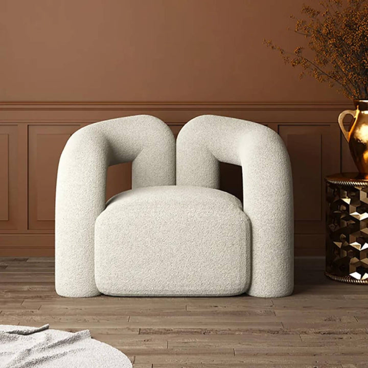 Front view of Asher designer armchair showcasing modern aesthetics and plush seating comfort