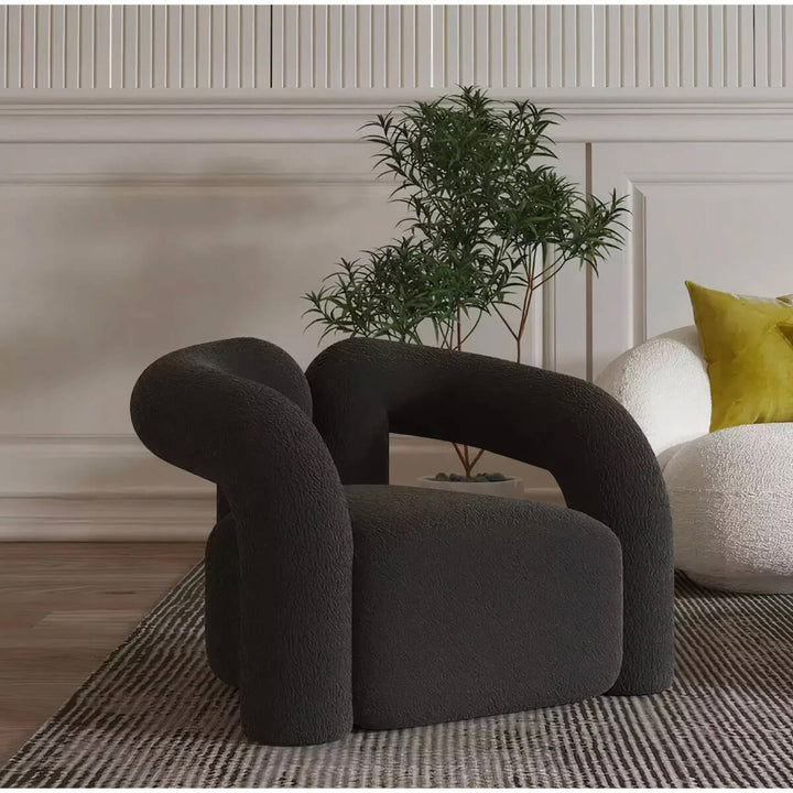 Side view of Asher designer armchair highlighting modern style and ergonomic comfort