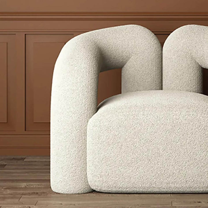 Detail front view of Asher designer armchair highlighting premium finish and stylish design