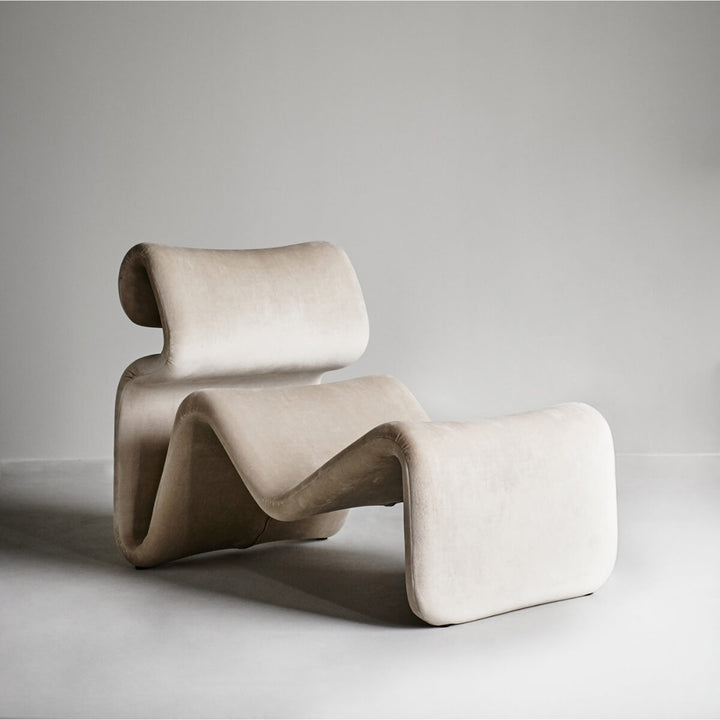 Side view of cream Electro lounge chair in Australia highlighting sleek and modern design
