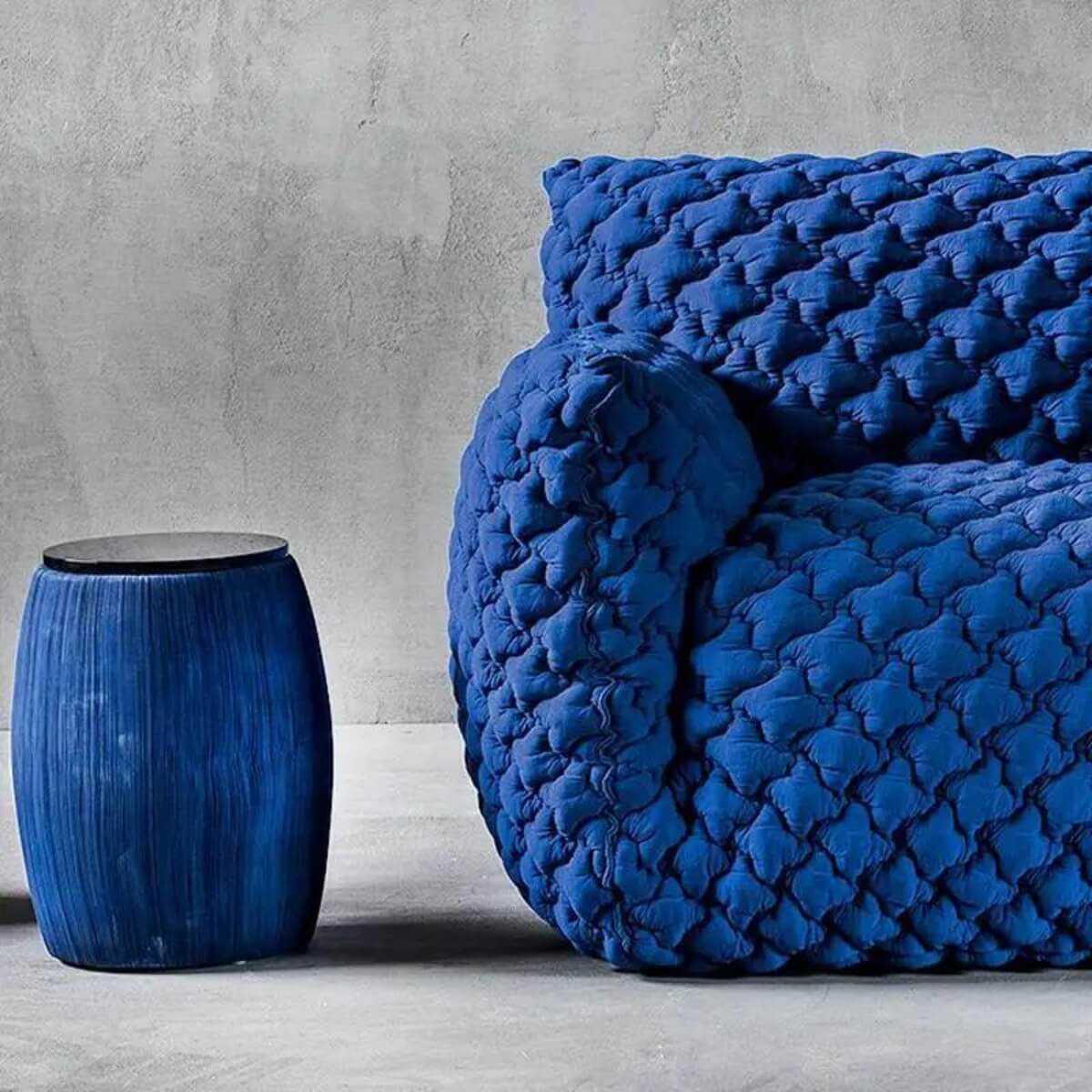Half detail view of Gabriella sponge embroidery lounge 1-seater chair highlighting fabric texture