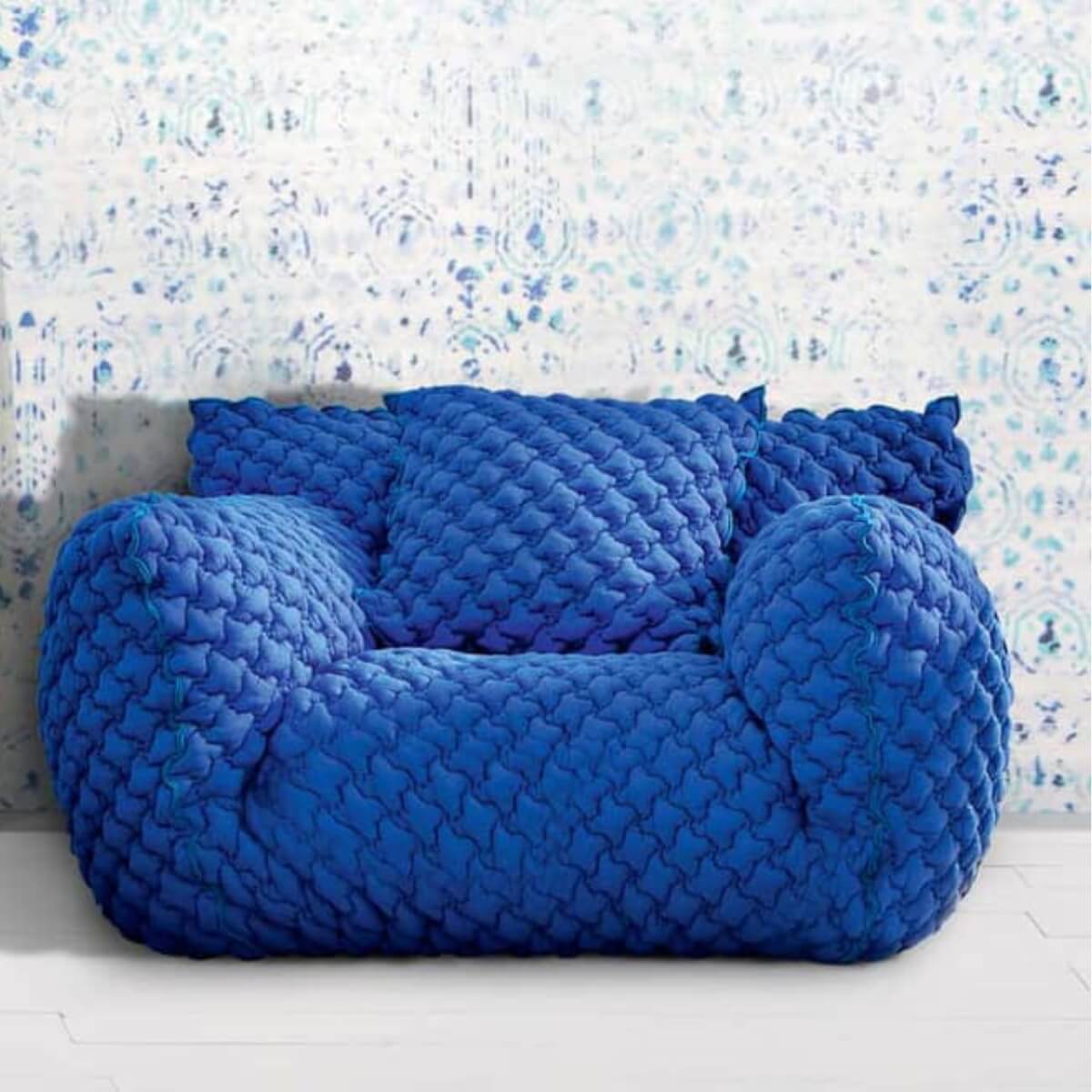 Detailed front view of Gabriella sponge embroidery lounge 1-seater chair highlighting texture