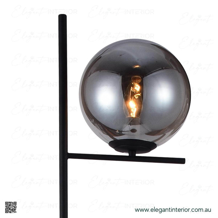 Detail view of Hugo floor lamp glass ball, highlighting elegant design and soft light glow