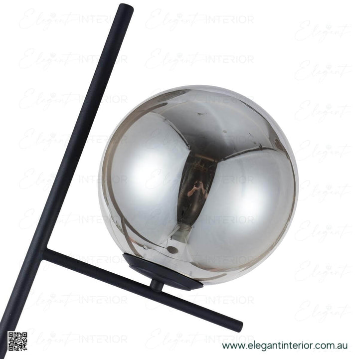 Close-up detail of Hugo floor lamp glass ball, showcasing smooth texture and elegant design