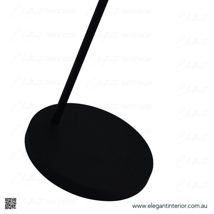 Stand view of Hugo floor lamp in elegant interior, featuring sleek modern base design