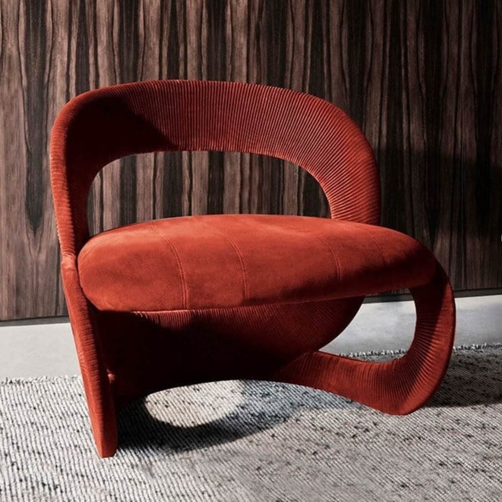 Side view of red modern armchair in Australia highlighting sleek design and comfort