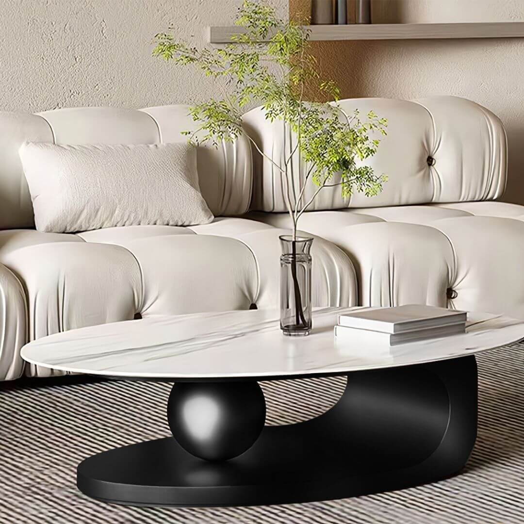 Side angle view of Monument modern coffee table with stainless steel ball base in Australian interior
