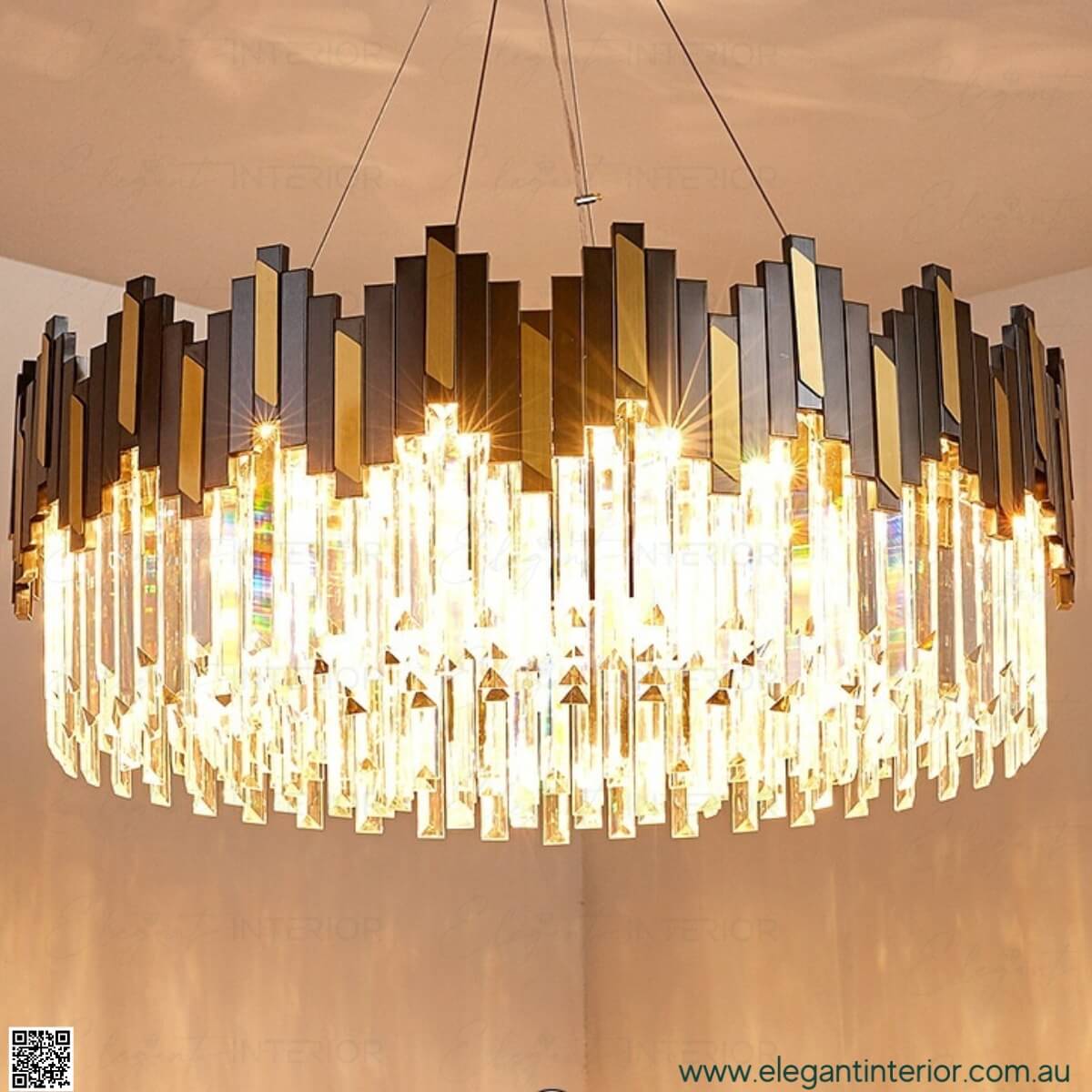 Front view of Sophia luxury crystal chandelier with lights on, glowing in elegant interior